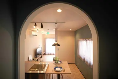an archway leading into a kitchen with a sink at \u76ee\u9ed2\u672c\u753a\uff5cMeguro Honcho in Tokyo