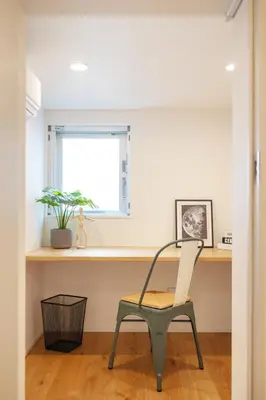 a chair in front of a desk in a room at Dash Living Kagurazaka in Tokyo