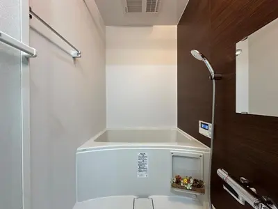 a small bathroom with a toilet with a sink at nestay miriz tokyo ikebukuro in Tokyo