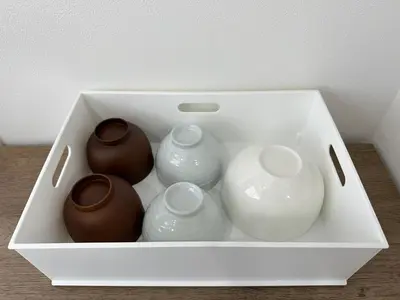 a white box with four vases in it at nestay miriz tokyo ikebukuro in Tokyo