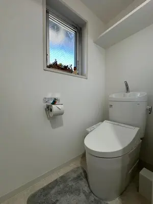 a bathroom with a white toilet and a window at nestay miriz tokyo ikebukuro in Tokyo