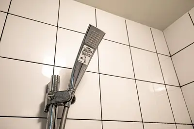 a spatula hanging on a white tiled wall at 18, Oji B, Detached house for rent, \u738b\u5b50B in Tokyo