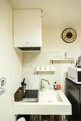a kitchen with a sink and a microwave at 18, Oji B, Detached house for rent, \u738b\u5b50B in Tokyo
