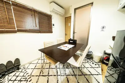 a dining room with a table and chairs at 18, Oji B, Detached house for rent, \u738b\u5b50B in Tokyo