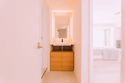 a bathroom with a sink and a mirror at One Shibuya Hill: Urban Oasis in Tokyo