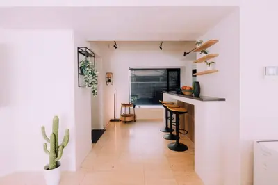 a living room with a counter and a cactus at One Shibuya Hill: Urban Oasis in Tokyo