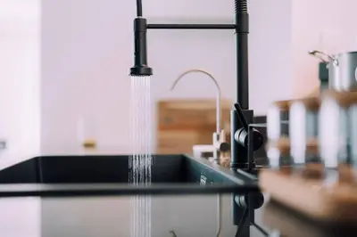 a kitchen sink with water coming out of it at One Shibuya Hill: Urban Oasis in Tokyo