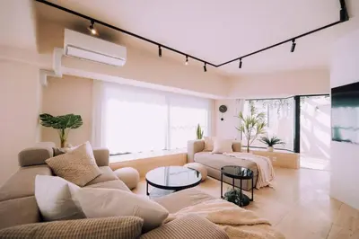 a living room with a couch and a table at One Shibuya Hill: Urban Oasis in Tokyo