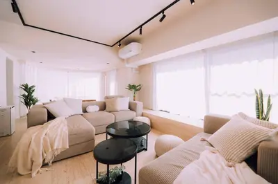 a living room with a couch and a table at One Shibuya Hill: Urban Oasis in Tokyo
