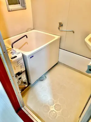 a small bathroom with a tub and a sink at Relax place in Tokyo