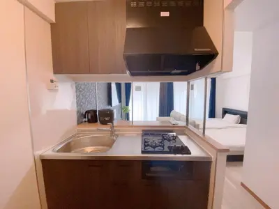a small kitchen with a sink and a microwave at Sunshine in Tokyo