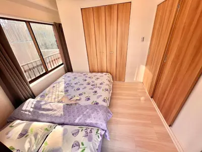 a small bedroom with a bed and a window at High-end Tokyo shinjuku Central Park Flat 5 in Tokyo