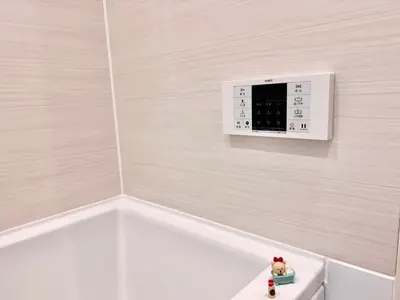 a bathroom with a clock on the corner of a wall at High-end Tokyo shinjuku Central Park Flat 5 in Tokyo