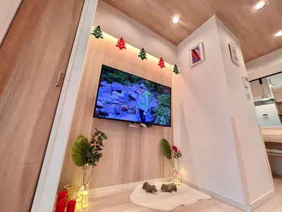 a living room with a tv and christmas decorations at High-end Tokyo shinjuku Central Park Flat 5 in Tokyo