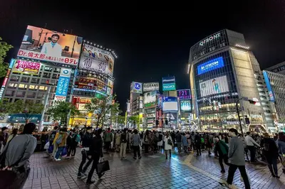 a crowd of people walking down a city street at night at Liberty house208 /Shibuya 5min by train Sangenjaya in Tokyo