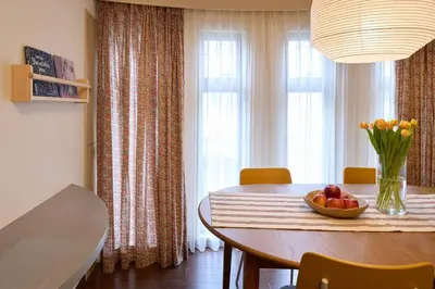 a dining room table with a bowl of fruit on it at Liberty house208 /Shibuya 5min by train Sangenjaya in Tokyo