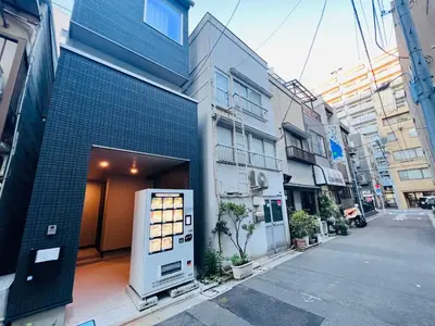 a building with a door on the side of a street at Kenki Ueno House-TT0170 in Tokyo
