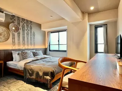 a bedroom with a bed and a table in it at LANG HOTEL Ueno # free Breakfast in Tokyo