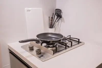 a frying pan sitting on top of a stove at The most comfortable and best choice for accommodation in Yoyogi YoSi2 in Tokyo