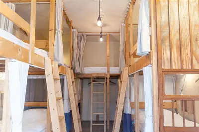 a room with two bunk beds in it at Tokyo Hikari Guesthouse in Tokyo