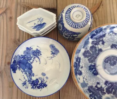 a group of blue and white plates on a table at Tokyo Hikari Guesthouse in Tokyo