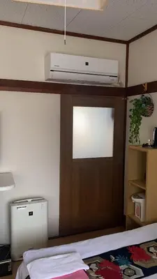 a bedroom with a room with a bed and a room at \u8fa3\u6912\u6c11\u5bbf in Tokyo