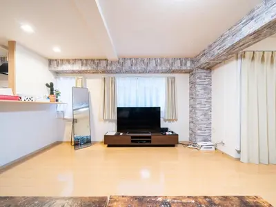 a large living room with a flat screen tv at Shinjuku, 1min walk from Kagurazaka Sta,80sqm,Family-Friendly, in Tokyo