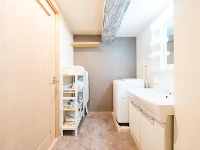 a bathroom with a sink and a washing machine at Shinjuku, 1min walk from Kagurazaka Sta,80sqm,Family-Friendly, in Tokyo