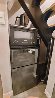 a tv sitting on a stand in a room at \u30eb\u30fc\u30c1\u30a7\u897f\u65b0\u5bbf in Tokyo