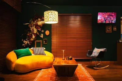 a living room with a yellow couch and a table at The Archaic / Luxury apartment near Shinjuku in Tokyo