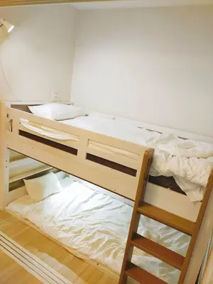 a bedroom with two bunk beds in a room at 15min to Haneda Airport - Homies House Kamata for up to 9 guests in Tokyo