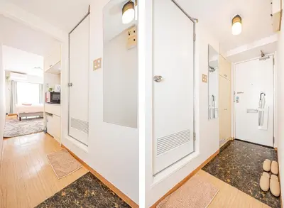 a hallway with white walls and glass doors at \u65b0\u5bbf\u533a\u6b4c\u821e\u4f0e\u753a\u8212\u9002\u623f\u6e90\u514d\u8d39Wi-Fi#03 in Tokyo