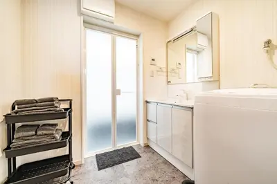 a bathroom with a sink and a mirror at 56, Horikiri-Syobuen, Detached House for Rent, \u5800\u5207\u83d6\u84b2\u5712 in Tokyo