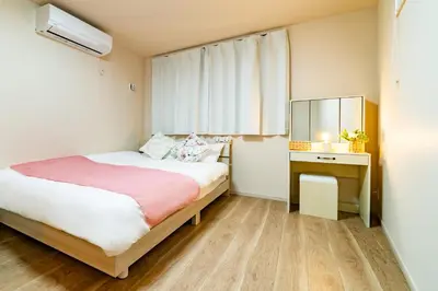 a small bedroom with a bed and a dresser at 56, Horikiri-Syobuen, Detached House for Rent, \u5800\u5207\u83d6\u84b2\u5712 in Tokyo