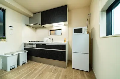 a kitchen with a sink and a refrigerator at 56, Horikiri-Syobuen, Detached House for Rent, \u5800\u5207\u83d6\u84b2\u5712 in Tokyo