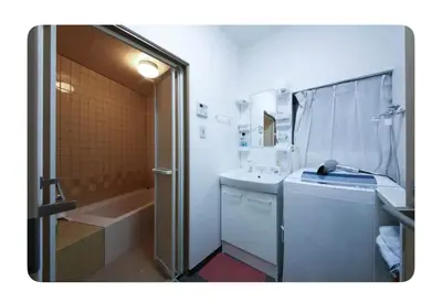 a bathroom with a shower and a sink and a tub at \u6d45\u8349\u685c\u6a4b\u30cf\u30a6\u30b9-Asakusa Sakurabashi House- in Tokyo