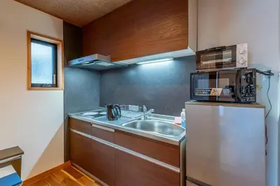 a small kitchen with a sink and a refrigerator at Yadoya Hototogisu - Vacation STAY 37432v in Tokyo