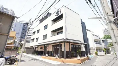 a white building on a city street with a street at Yadoya Hototogisu - Vacation STAY 37432v in Tokyo