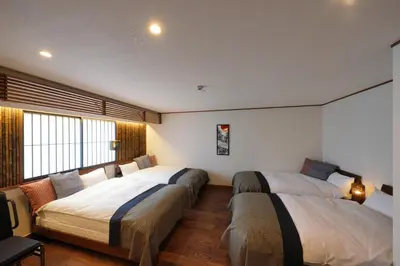 a bedroom with two beds and a window at Yadoya Hototogisu - Vacation STAY 37442v in Tokyo
