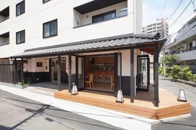 a small building with a deck on a street at Yadoya Hototogisu - Vacation STAY 37442v in Tokyo