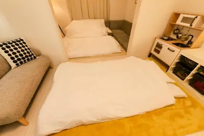 a small room with two beds and a couch at HOTEL Dining Plus - Vacation STAY 39103v in Tokyo