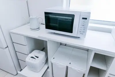 a white desk with a microwave and a toilet at HOTEL Dining Plus - Vacation STAY 39103v in Tokyo