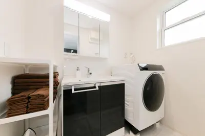 a white bathroom with a sink and a washing machine at HOTEL Dining Plus - Vacation STAY 39103v in Tokyo