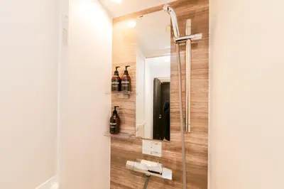 a bathroom with a shower with a mirror at HOTEL Dining Plus - Vacation STAY 39103v in Tokyo