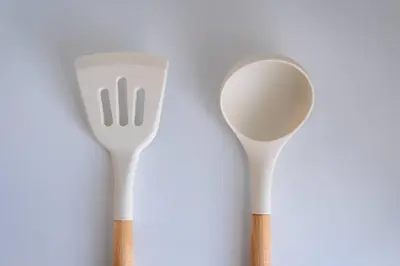 two plastic spoons sitting next to each other at unito residence HIGASHISHINJUKU in Tokyo
