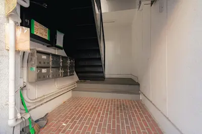 a corridor of an empty dugout in a baseball field at unito residence WASEDA in Tokyo