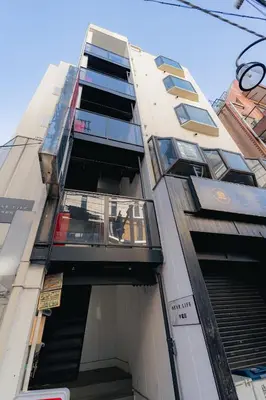 a tall building with balconies on the side of it at unito residence WASEDA in Tokyo