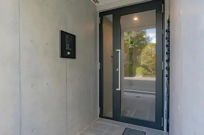 a glass door in a room with a window at unito residence OTSUKA in Tokyo