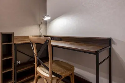 a desk with a chair and a lamp on it at Felice Nishi-Shinjuku in Tokyo