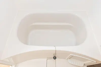 a kitchen with a white ceiling and a sink at Himawari in Tokyo